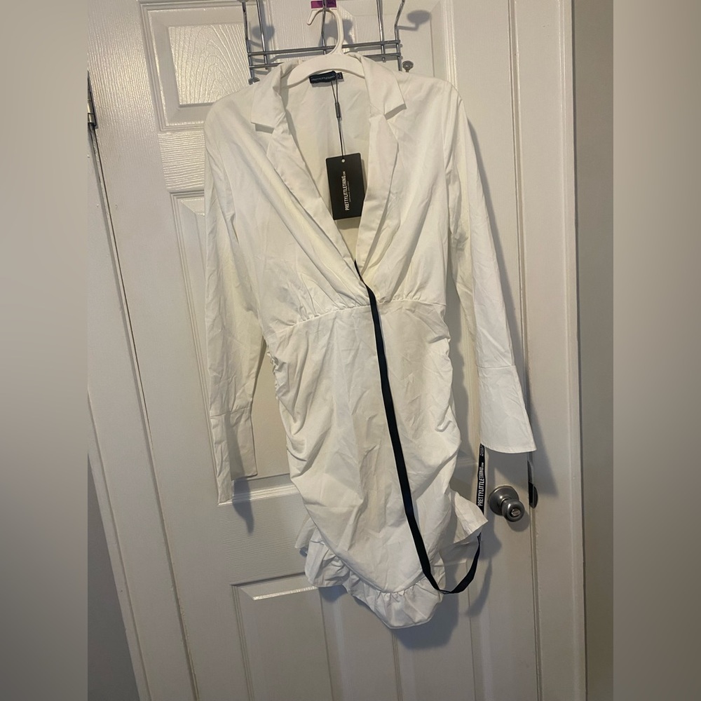 White, tight fitted, low neck dress